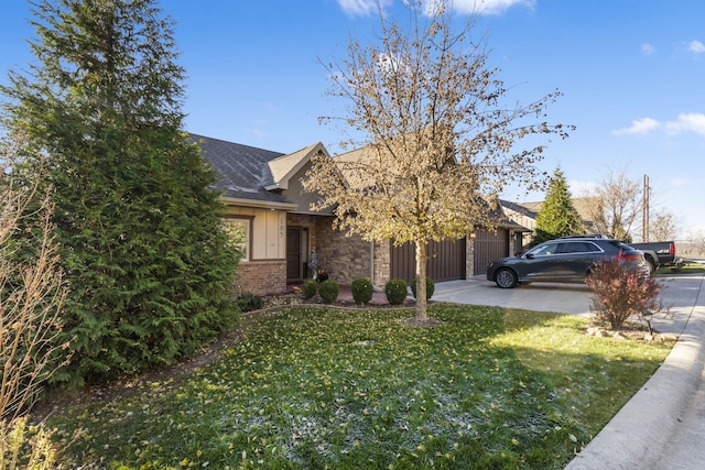 view of property hidden behind natural elements featuring a front yard and a garage