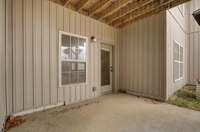 entrance to property featuring a patio