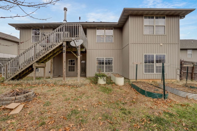 back of house with a patio area and a deck