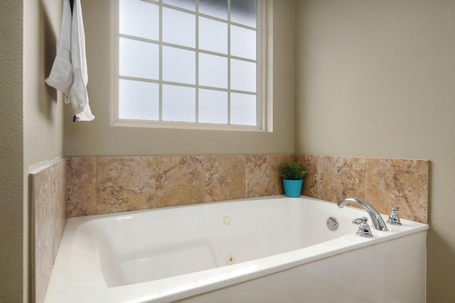 bathroom featuring a tub to relax in