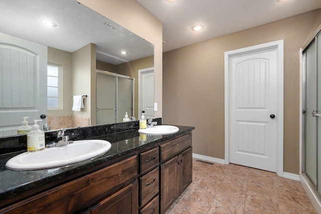 bathroom with vanity and walk in shower