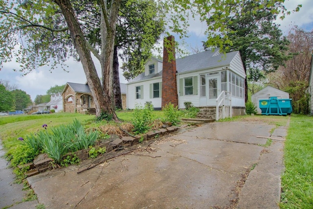 view of front of house with a sunroom