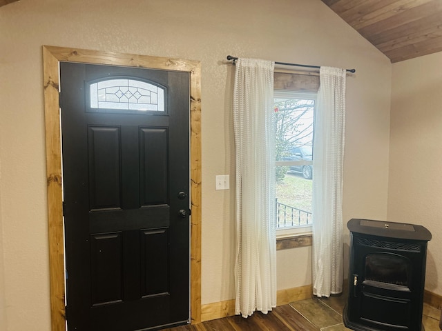 foyer entrance featuring lofted ceiling, dark wood-type flooring, and wooden ceiling