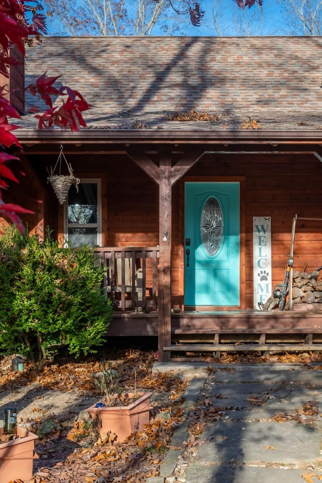 property entrance with covered porch