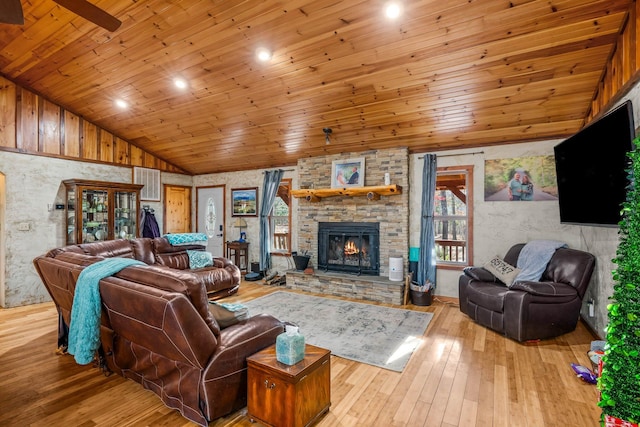 living room with lofted ceiling, light hardwood / wood-style flooring, ceiling fan, a fireplace, and wood ceiling