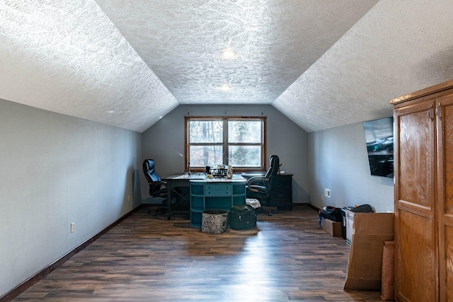 home office featuring a textured ceiling, dark hardwood / wood-style floors, and lofted ceiling