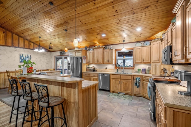 kitchen with pendant lighting, wooden ceiling, sink, a kitchen island, and stainless steel appliances