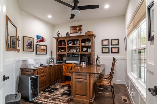 office space featuring dark hardwood / wood-style floors and ceiling fan