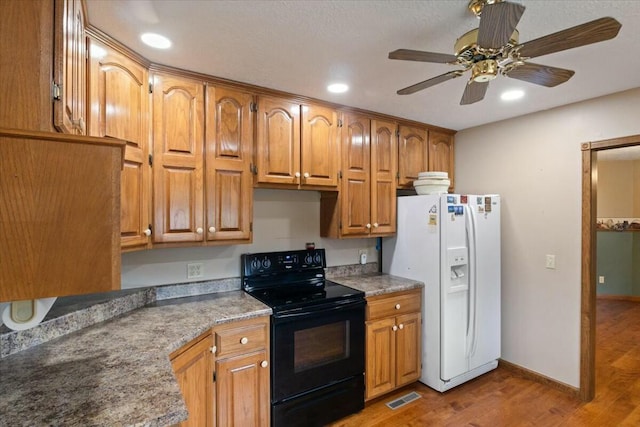 kitchen with ceiling fan, white fridge with ice dispenser, light hardwood / wood-style floors, and black range with electric cooktop