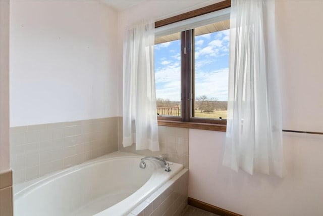 bathroom with tiled tub