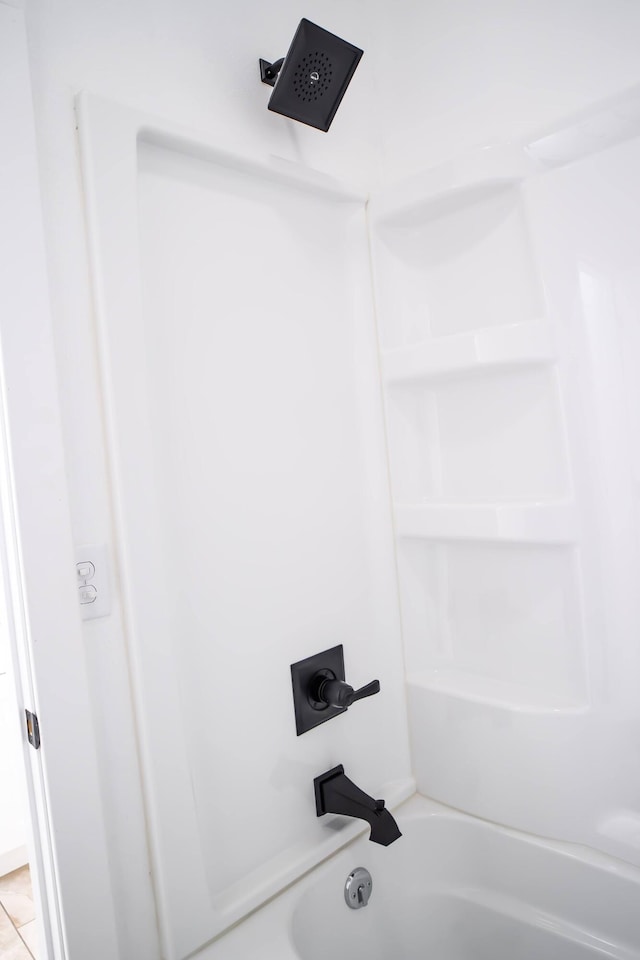 bathroom featuring tile patterned floors and shower / bathing tub combination