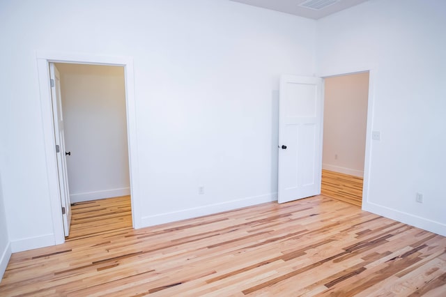 unfurnished room with light hardwood / wood-style flooring