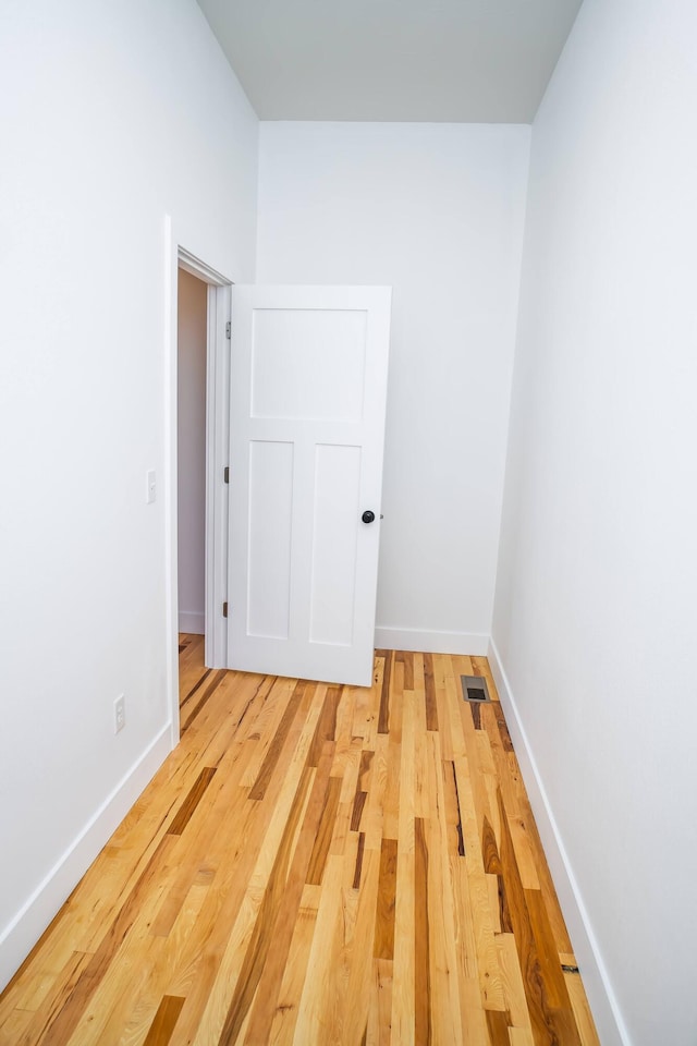 spare room featuring light wood-type flooring