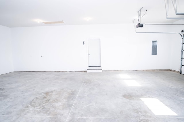 garage featuring a garage door opener and electric panel