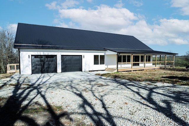 view of front of home with a garage and a deck