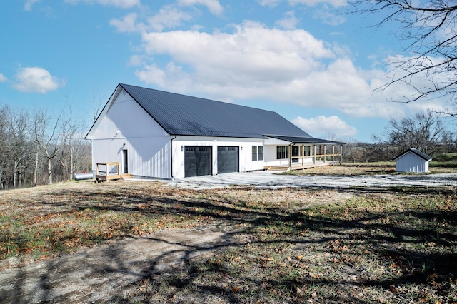 exterior space with a porch and a garage