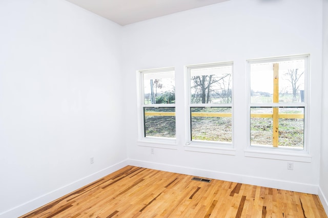 empty room with wood-type flooring