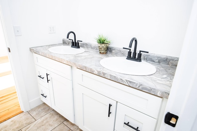 bathroom with tile patterned flooring and vanity