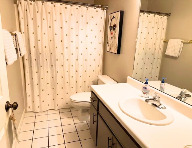 366 Wimbledon Dr Unit 10, Branson, MO 65616 - bathroom with toilet, tile patterned flooring, vanity, and a shower with shower curtain