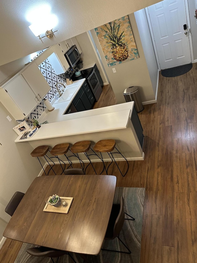 366 Wimbledon Dr Unit 10, Branson, MO 65616 - dining room featuring wood-type flooring and baseboards