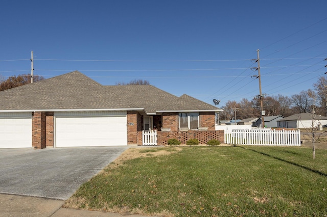 ranch-style home with a front yard and a garage