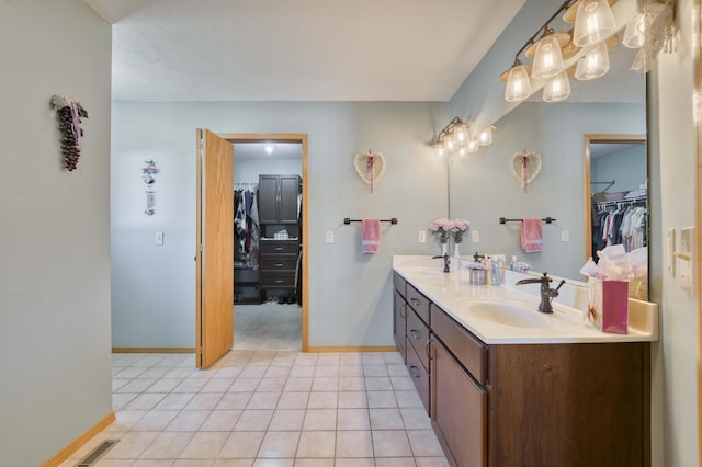 bathroom with tile patterned flooring and vanity