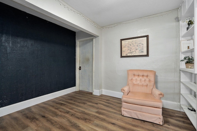 sitting room featuring dark hardwood / wood-style floors