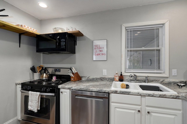 kitchen with white cabinets, sink, and stainless steel appliances