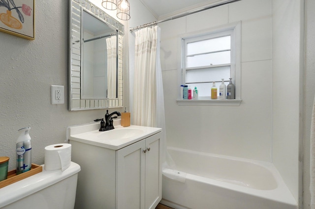 full bathroom featuring shower / bath combination with curtain, toilet, crown molding, and vanity