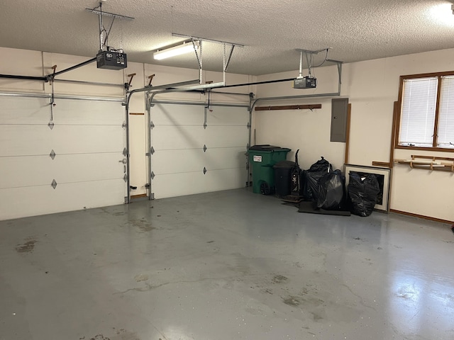 garage featuring electric panel and a garage door opener