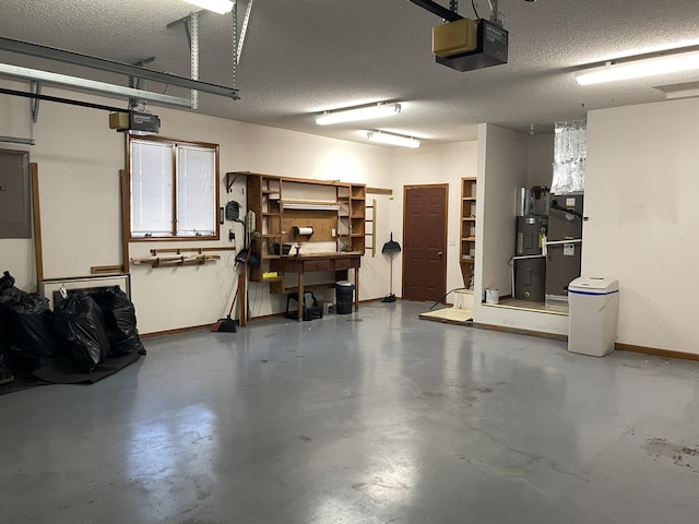 garage featuring heating unit and a garage door opener