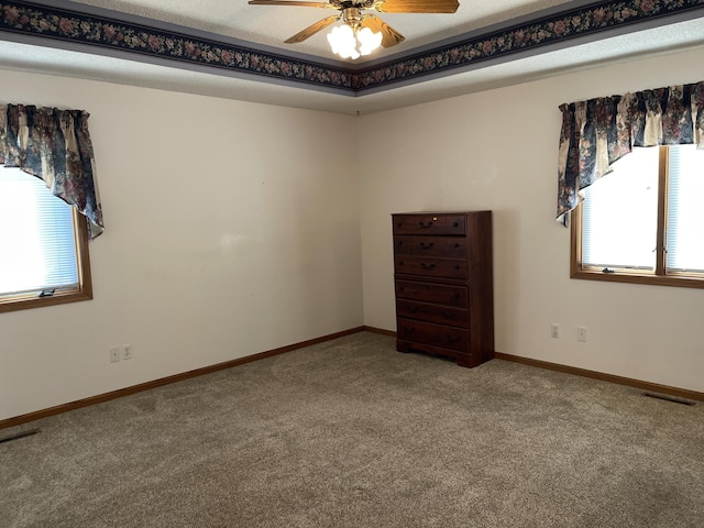 carpeted empty room with ceiling fan