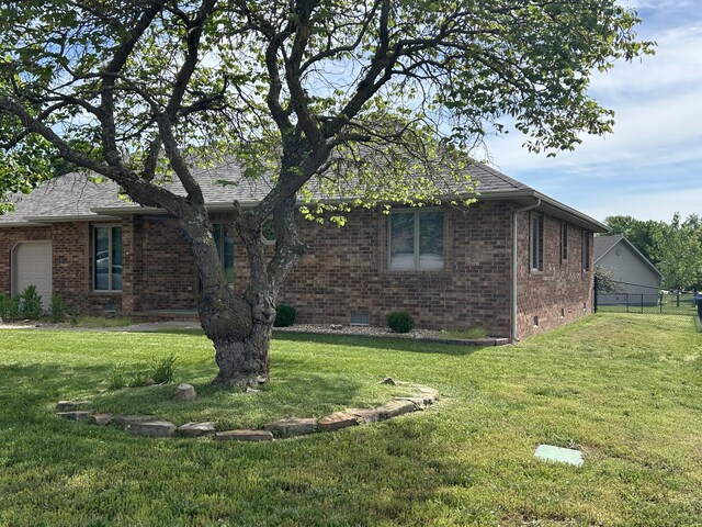 1660 S Meadow Ln, Bolivar, MO 65613 - view of front facade with brick siding, crawl space, and a shingled roof