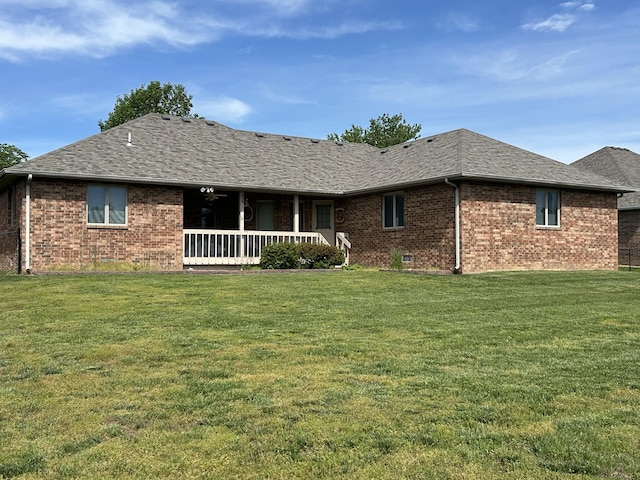 1660 S Meadow Ln, Bolivar, MO 65613 - back of house featuring brick siding, a yard, a shingled roof, and covered porch