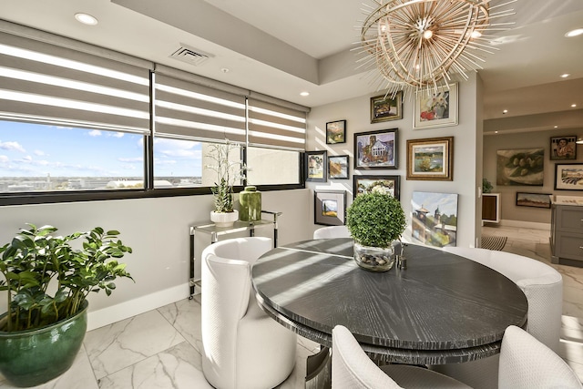 dining space with a notable chandelier