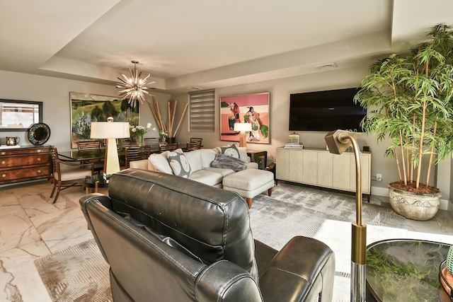 living room with an inviting chandelier