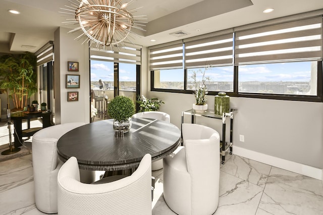 dining space featuring an inviting chandelier