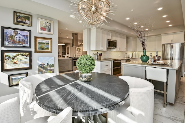 dining area with an inviting chandelier