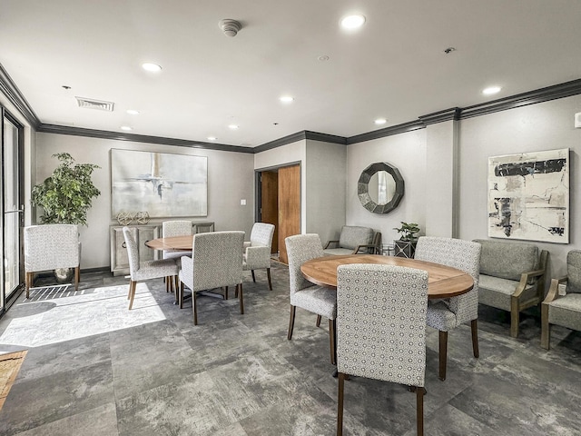 dining space with ornamental molding