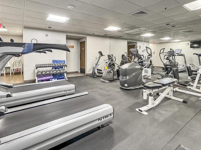 workout area featuring a paneled ceiling