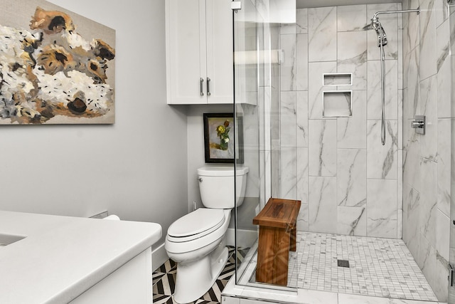 bathroom with a shower with door and toilet