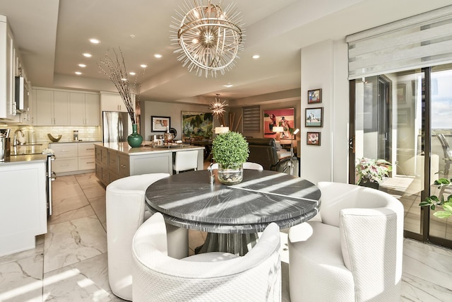 dining space with a notable chandelier