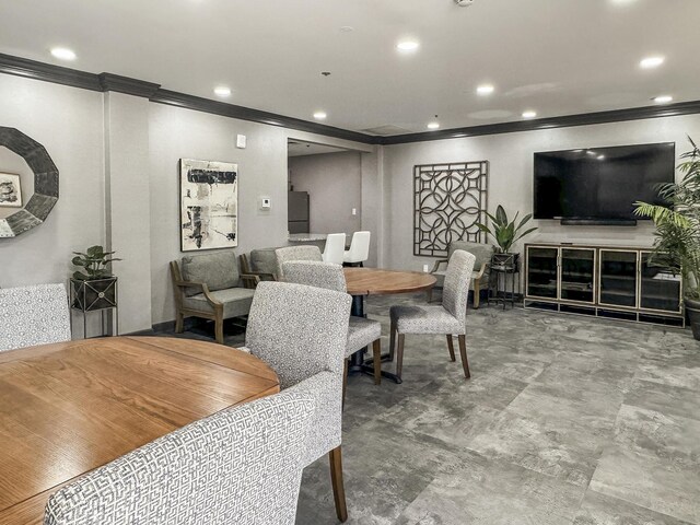 dining room featuring crown molding