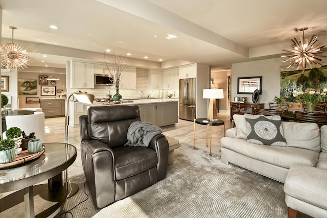 tiled living room featuring an inviting chandelier