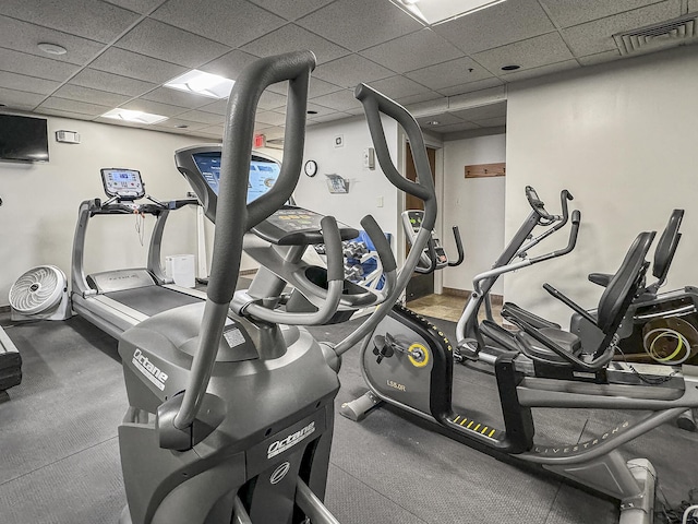 exercise room with a paneled ceiling