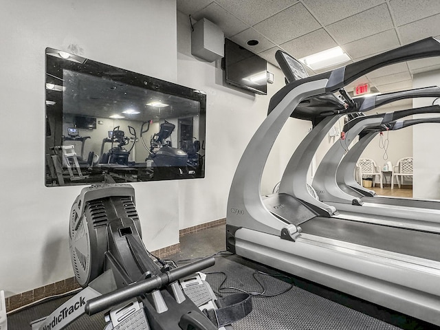 exercise room featuring a paneled ceiling