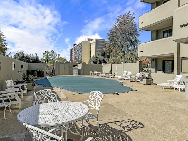 view of pool featuring a patio