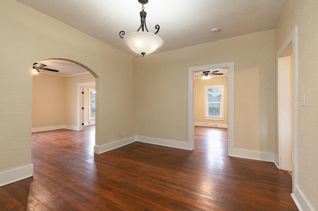 unfurnished room with dark wood-type flooring