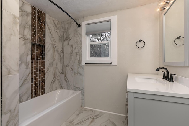 bathroom with vanity, a textured ceiling, and tiled shower / bath combo