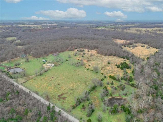 birds eye view of property featuring a rural view